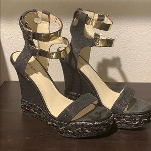 Bebe Black Wedges with gold accents
